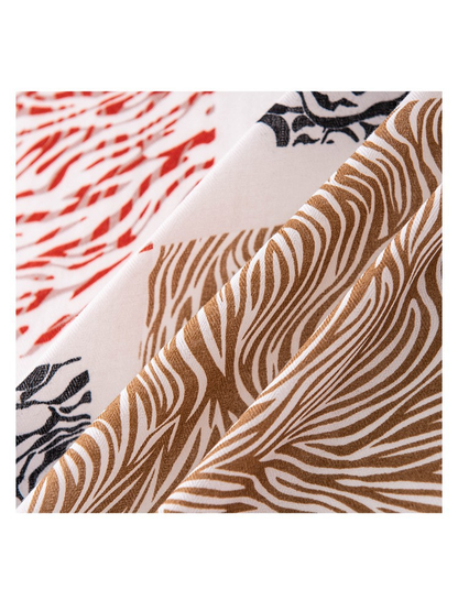 Close-up of the scarf's brown wavy print and fine woven-look texture