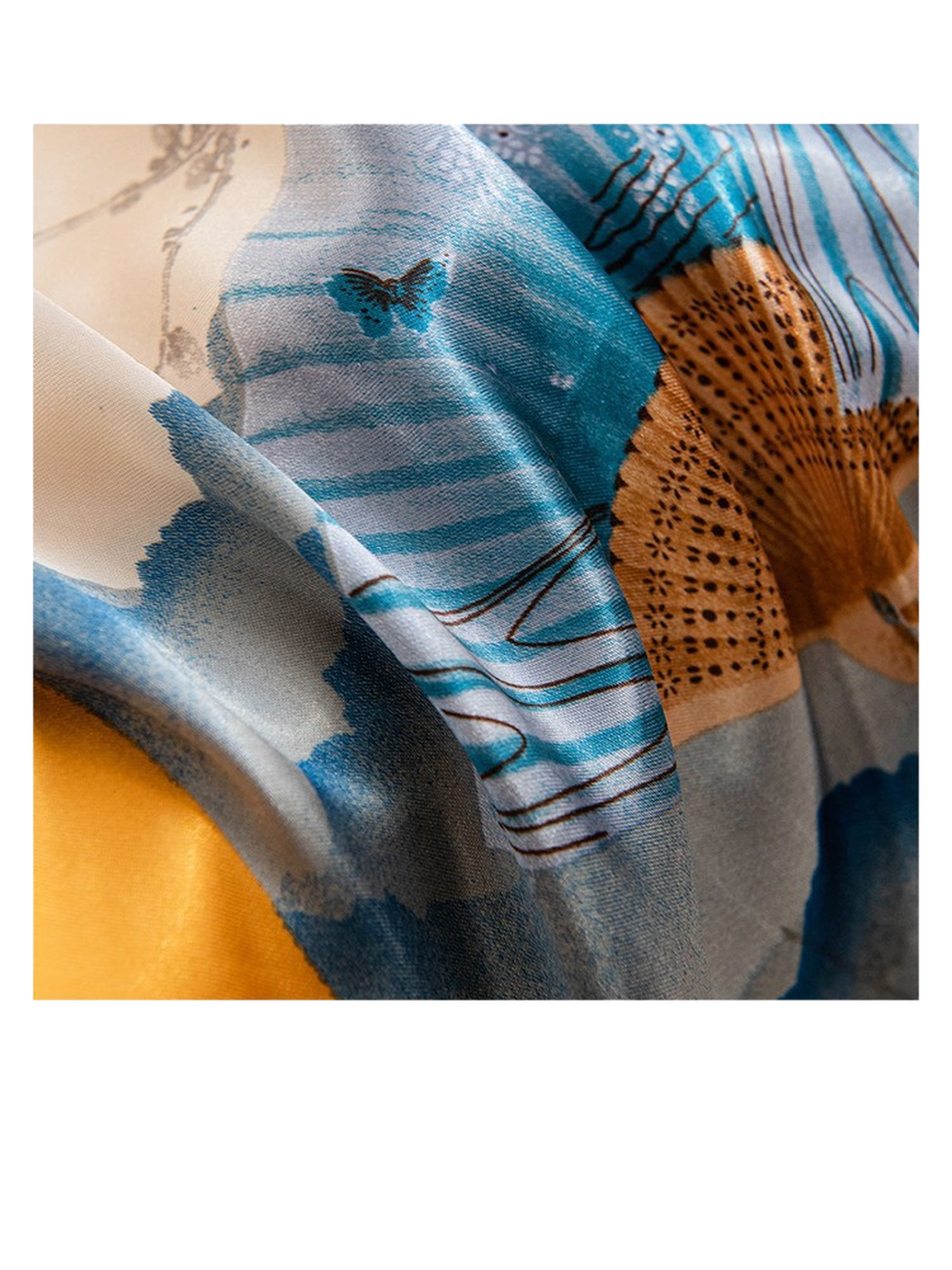 Close-up of the blue folding-fan print and smooth scarf surface