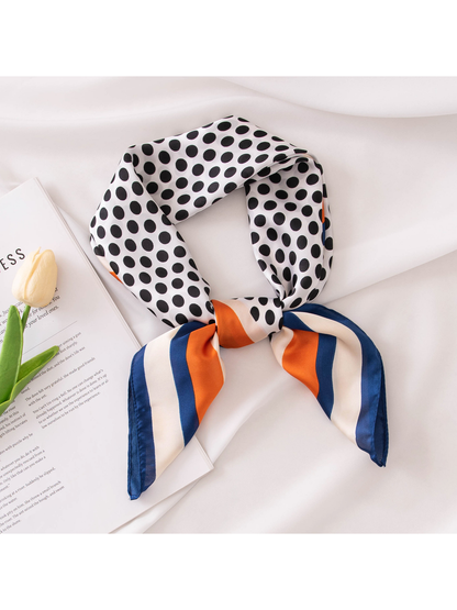 Polka-dot square scarf tied in a loose neck-style knot