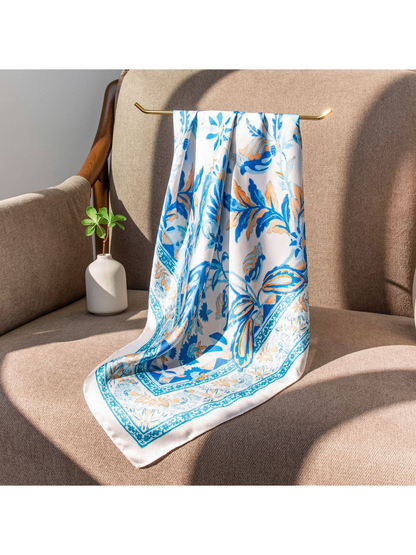 Blue, white and peach floral scarf draped over a chair