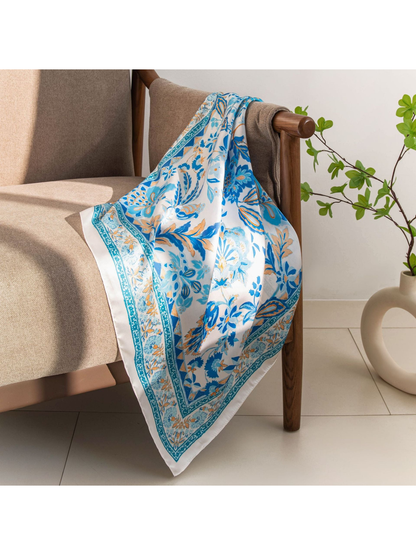 Blue floral scarf displayed across a chair arm
