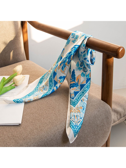 Blue floral scarf draped over a wooden chair arm with pointed ends