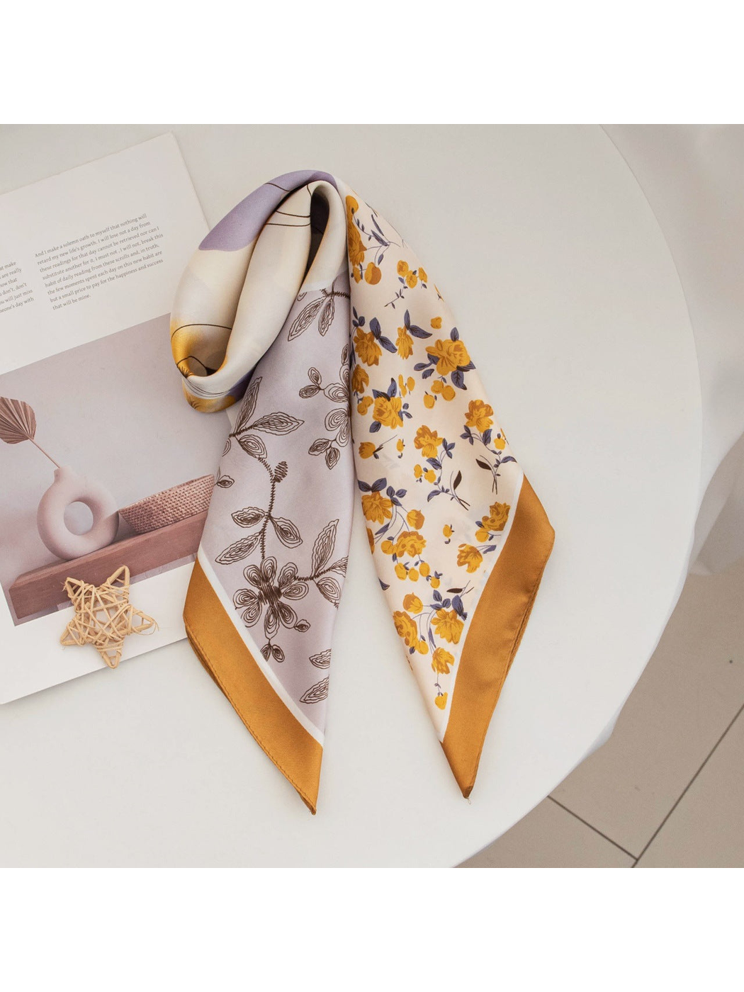 Ochre and lavender floral square scarf arranged on a round table