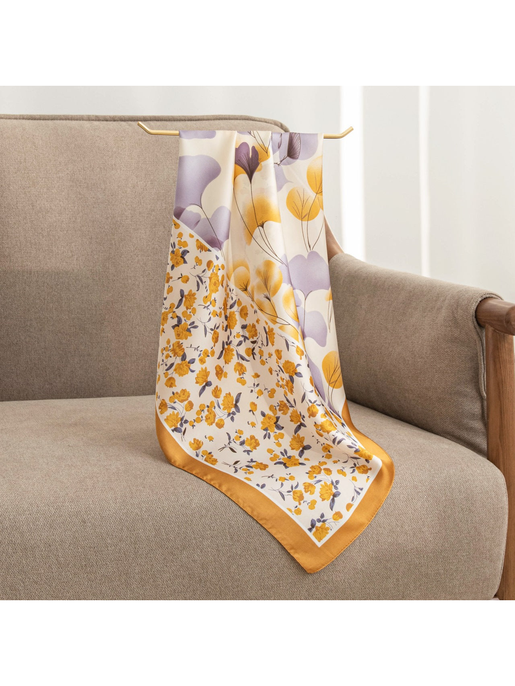 Ochre and lavender floral square scarf draped over an armchair