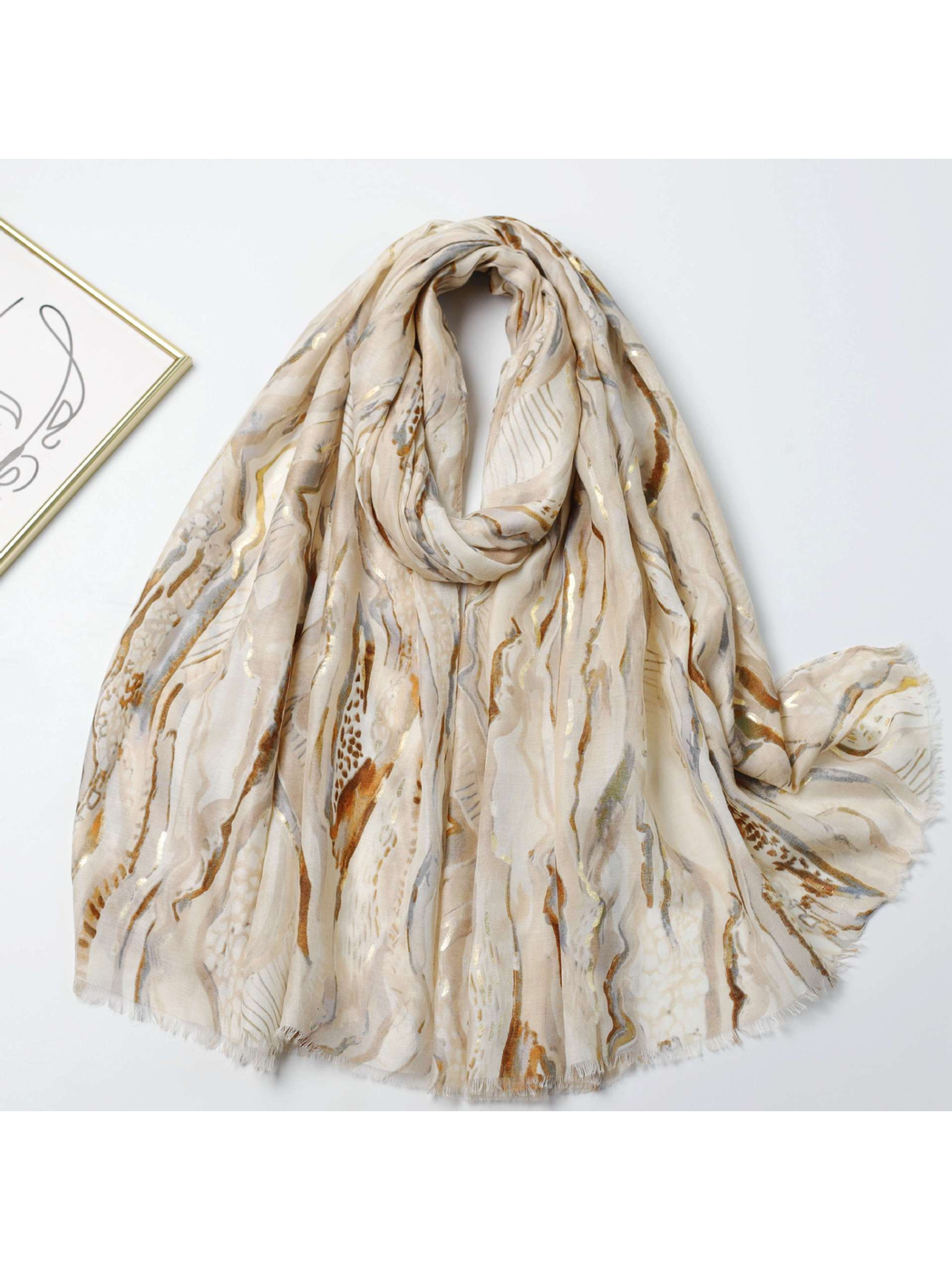 Neutral-toned abstract marbled scarf with gold-tone accents, full draped view