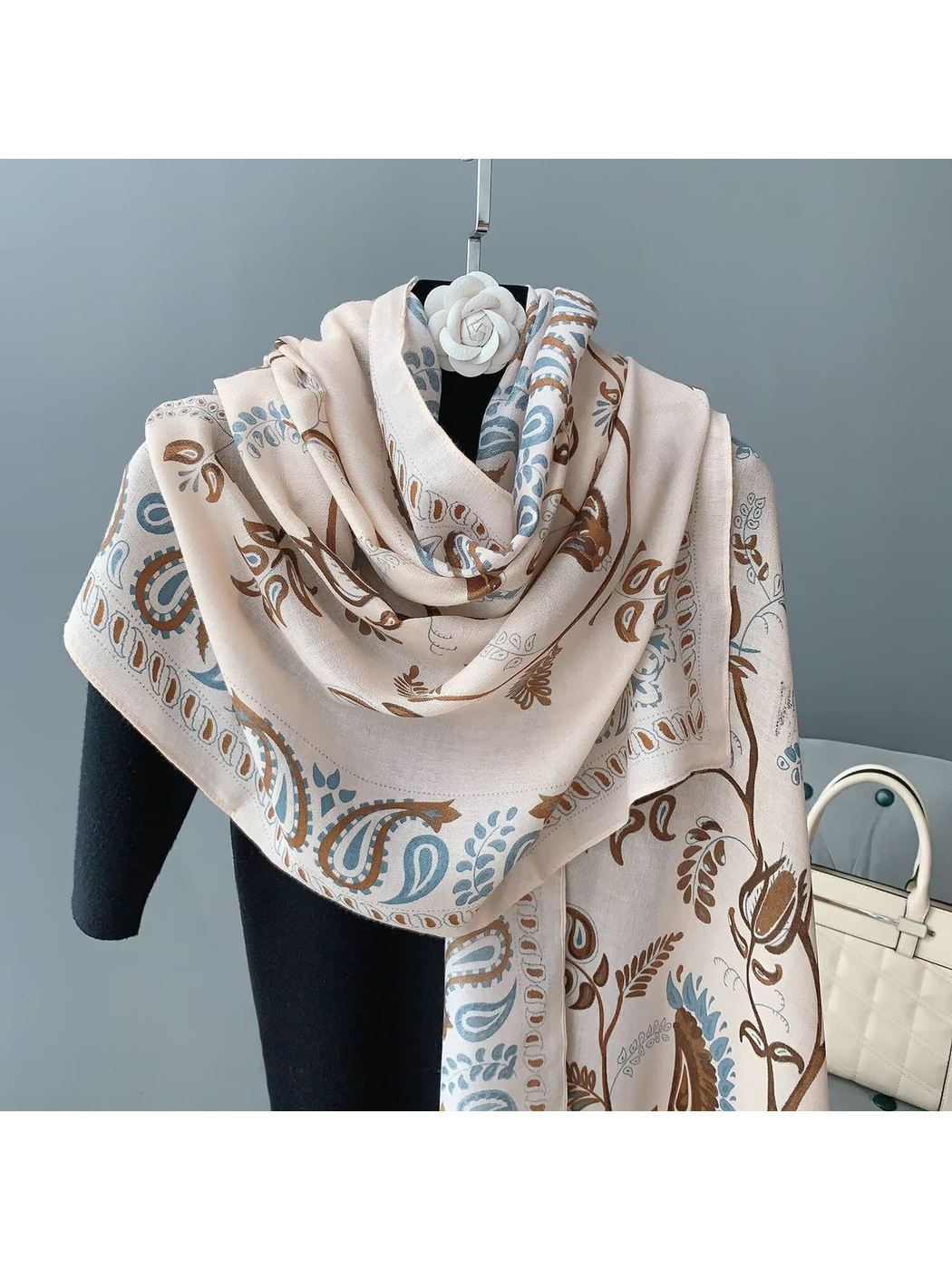 Blush paisley scarf with bird and botanical motifs, draped front view
