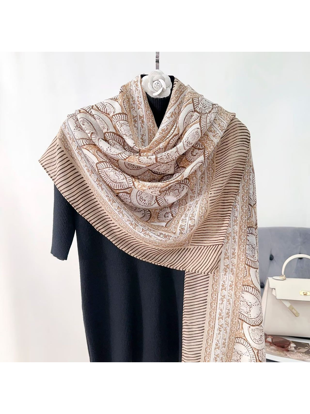 Brown ornamental scarf with striped border, draped front view