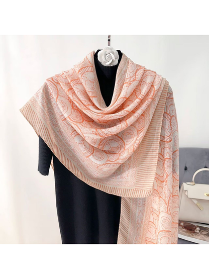Orange ornamental scarf with striped border, draped front view