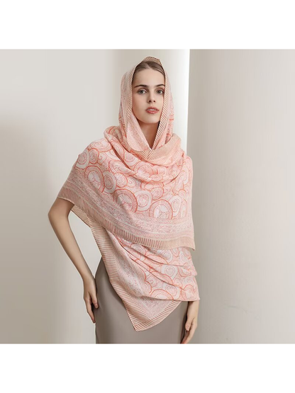 Orange ornamental scarf styled over the head and shoulders