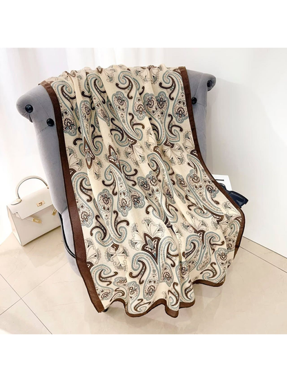 Brown paisley scarf draped over a chair