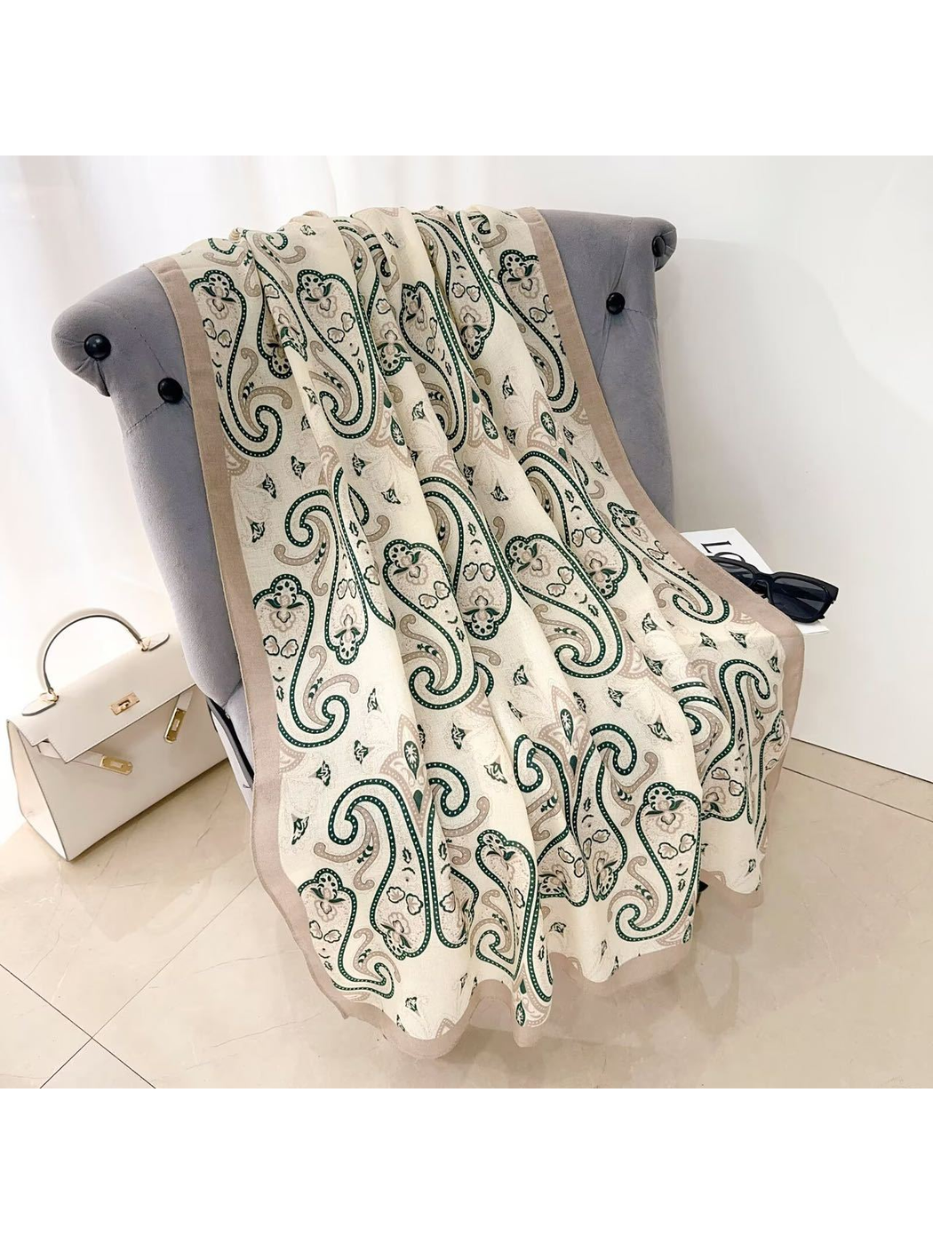 Dark Green paisley scarf with a taupe border, draped view