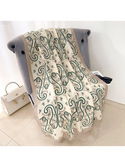 Dark Green paisley scarf with a taupe border, draped view