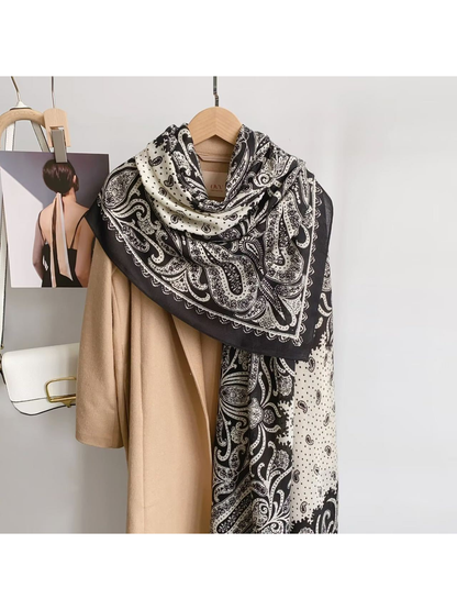Black White paisley scarf draped over a camel coat
