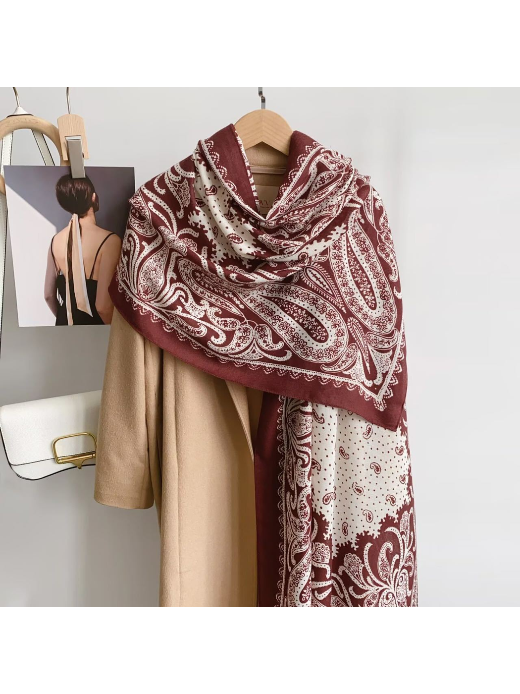 Dark Red paisley scarf draped over a camel coat
