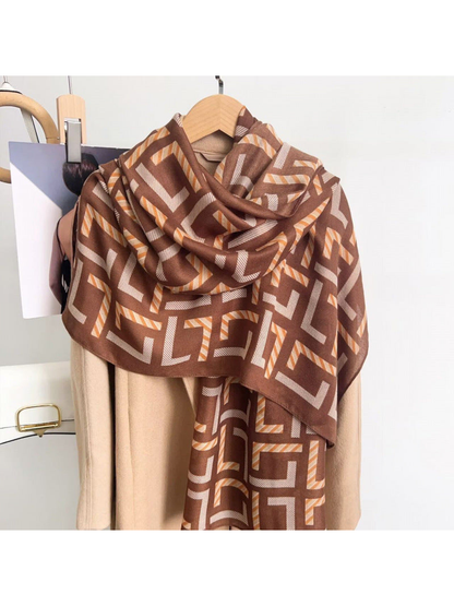 Brown geometric scarf draped over a coat