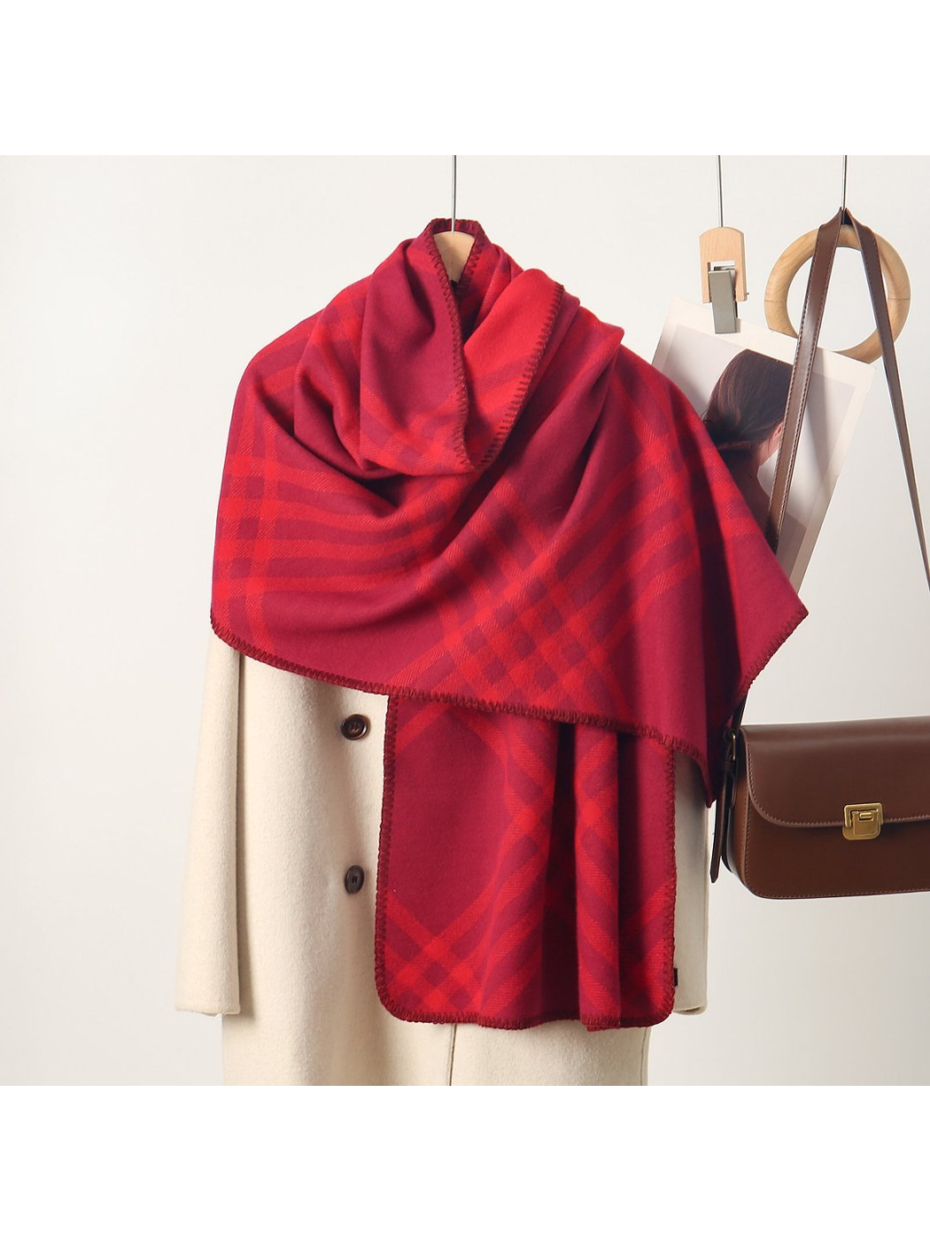 Burgundy plaid rectangular scarf with stitched edges, draped display