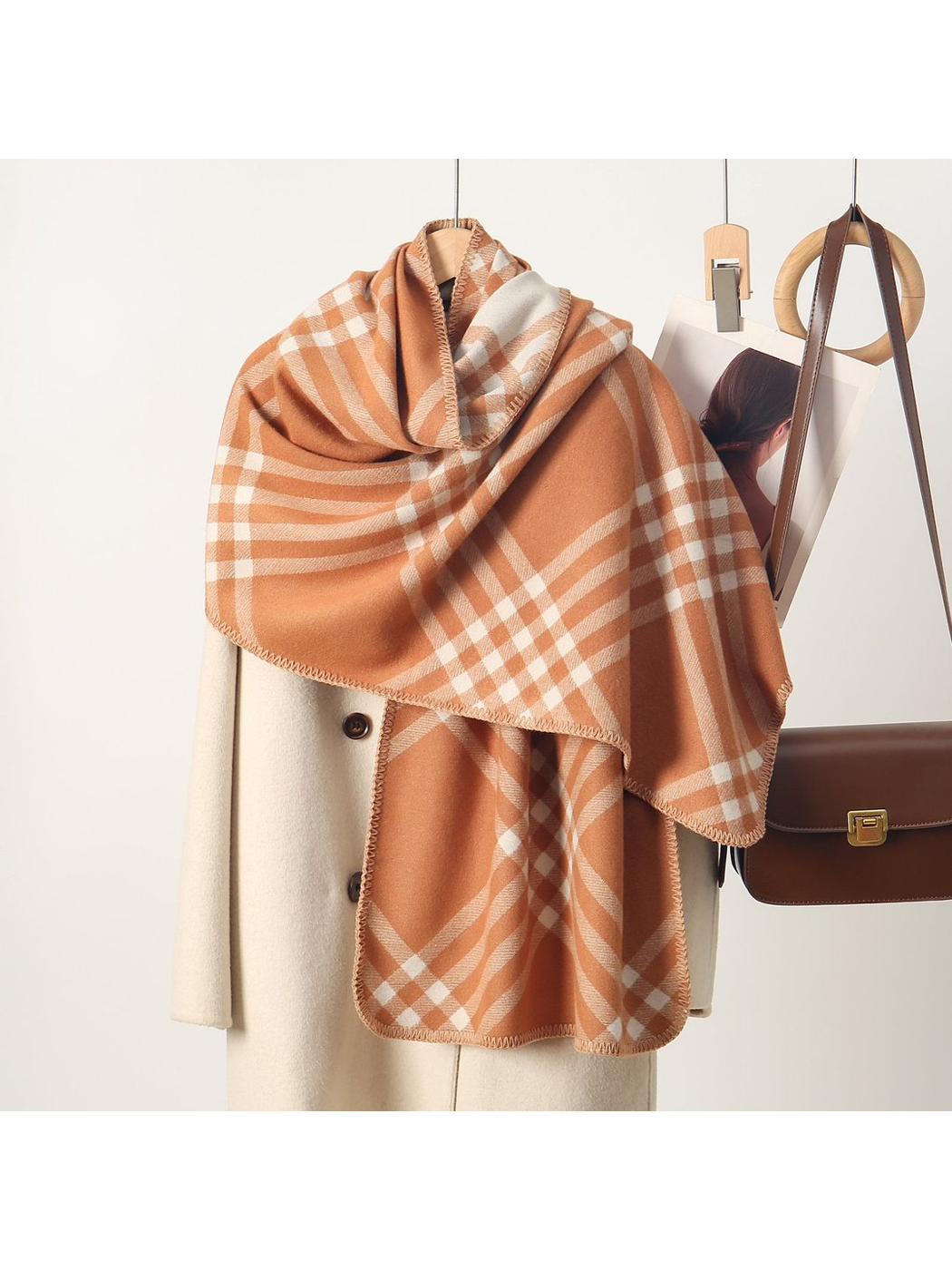 Caramel plaid rectangular scarf with stitched edges, draped display