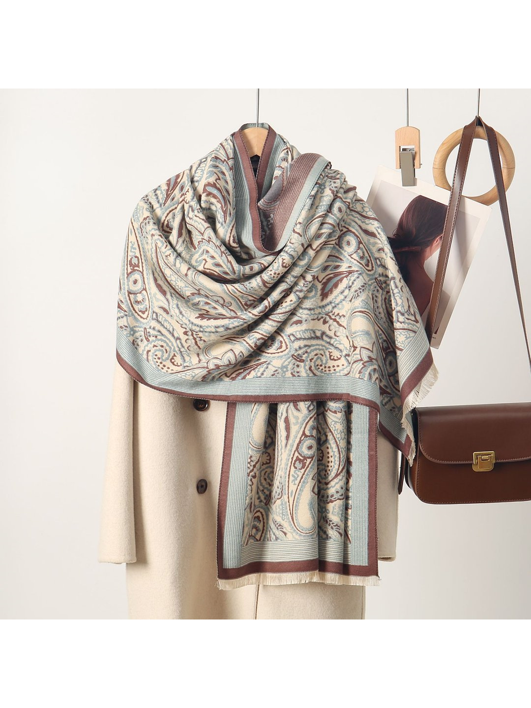 Light Blue paisley scarf with contrasting border and short fringe, draped view