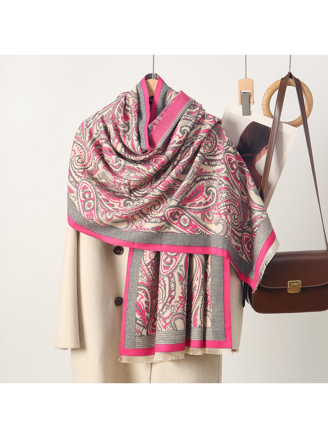Fuchsia paisley scarf with striped border and short fringe, draped view