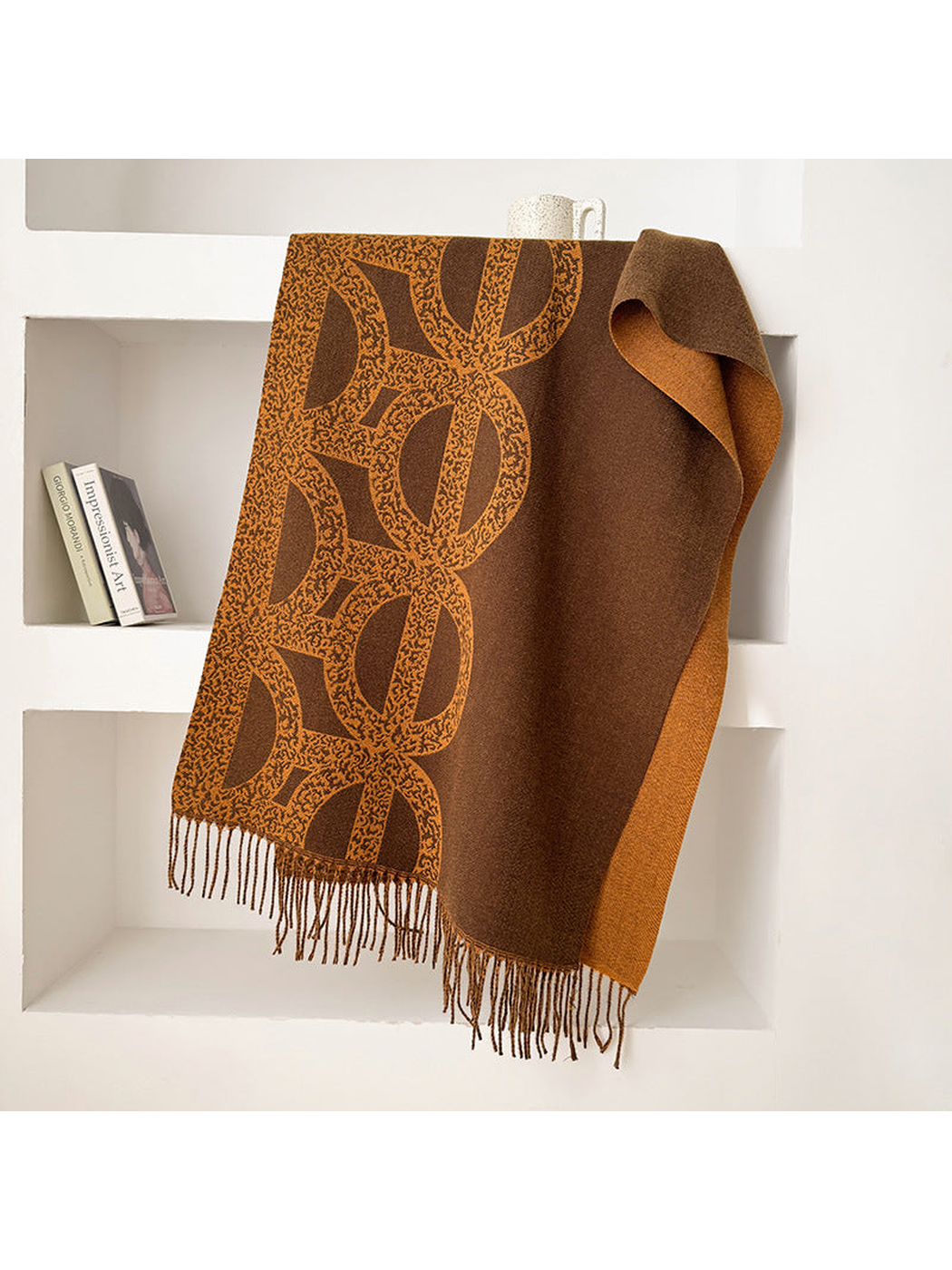Dark Coffee geometric scarf draped with a contrasting reverse and fringe
