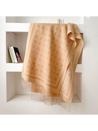 Beige abstract-line scarf with framed border and fringed ends, draped display