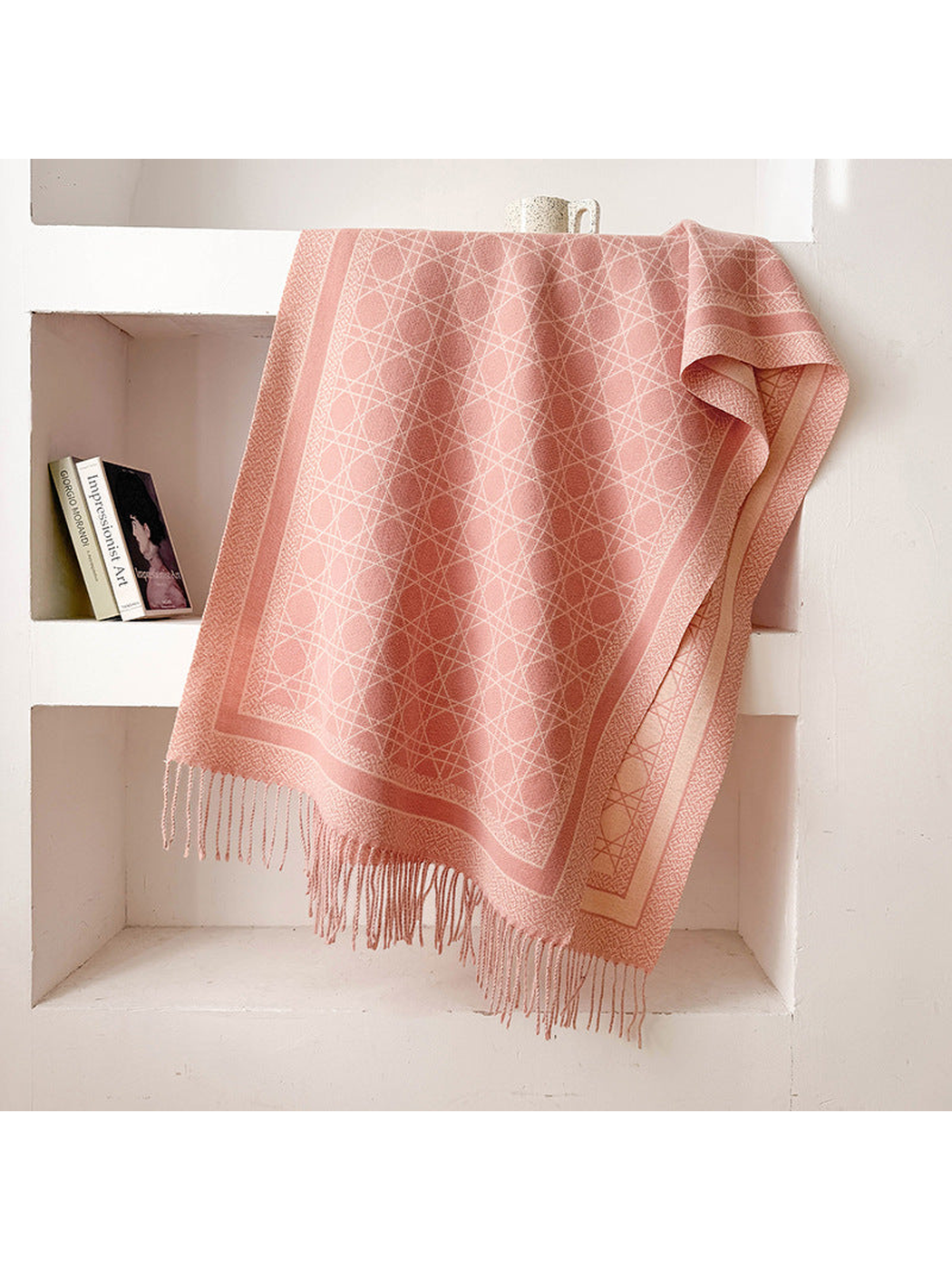 Light Pink abstract-line scarf with framed border and fringed ends, draped display