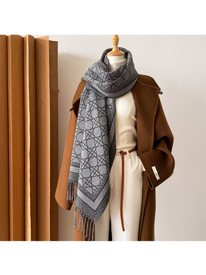 Black Gray abstract-line scarf wrapped at the neck with a long fringed end draped forward