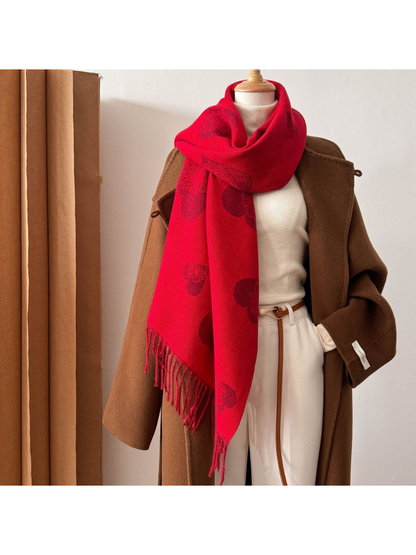 Red heart and floral scarf styled in a long wrap on a mannequin