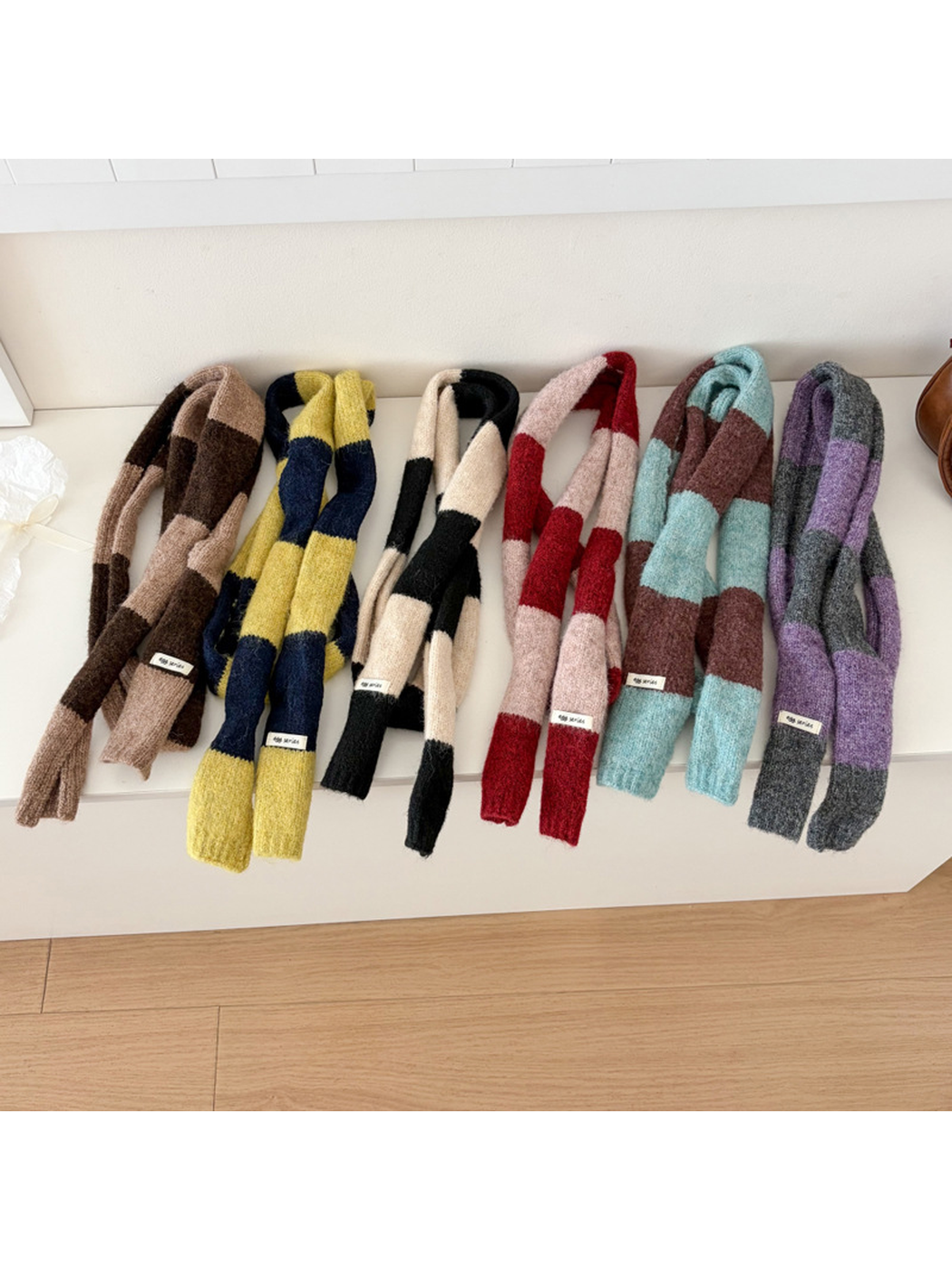 Six wide-striped narrow scarf styles displayed together