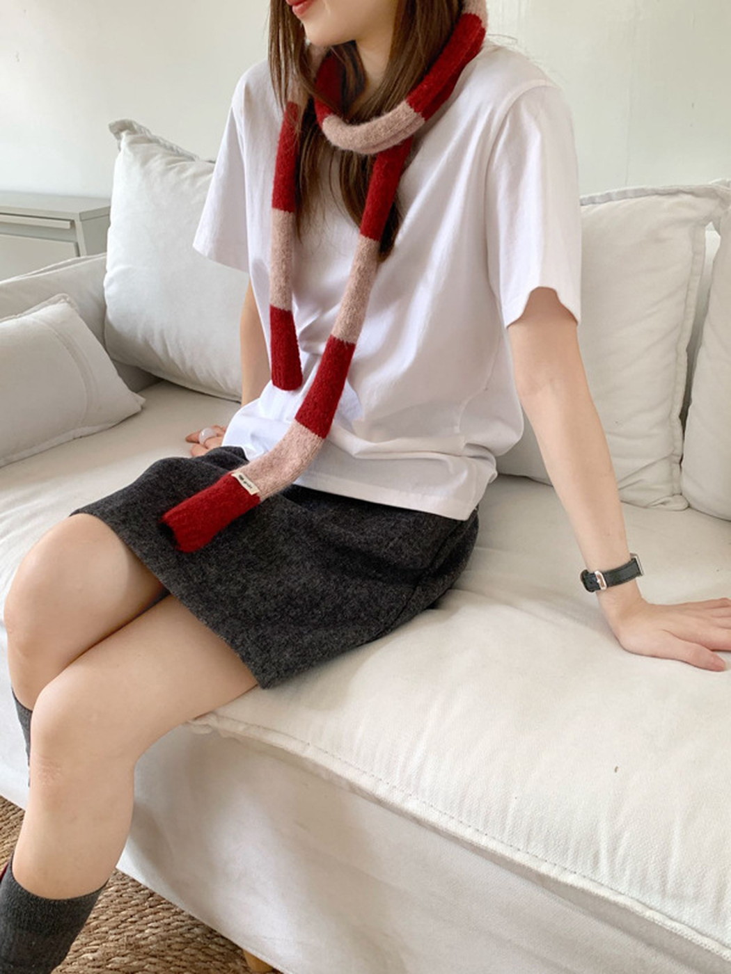 Red Pink striped narrow scarf styled with a loose front knot