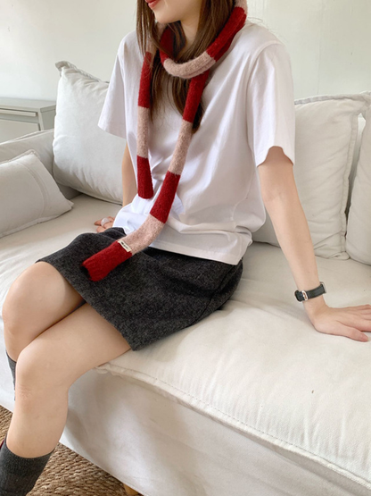 Red Pink striped narrow scarf styled with a loose front knot