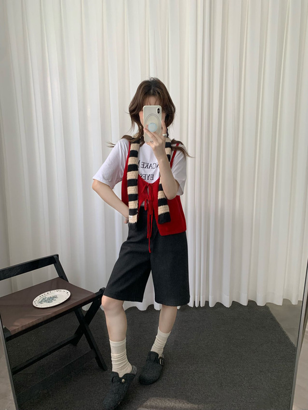 Mirror outfit view with the black-and-cream striped scarf