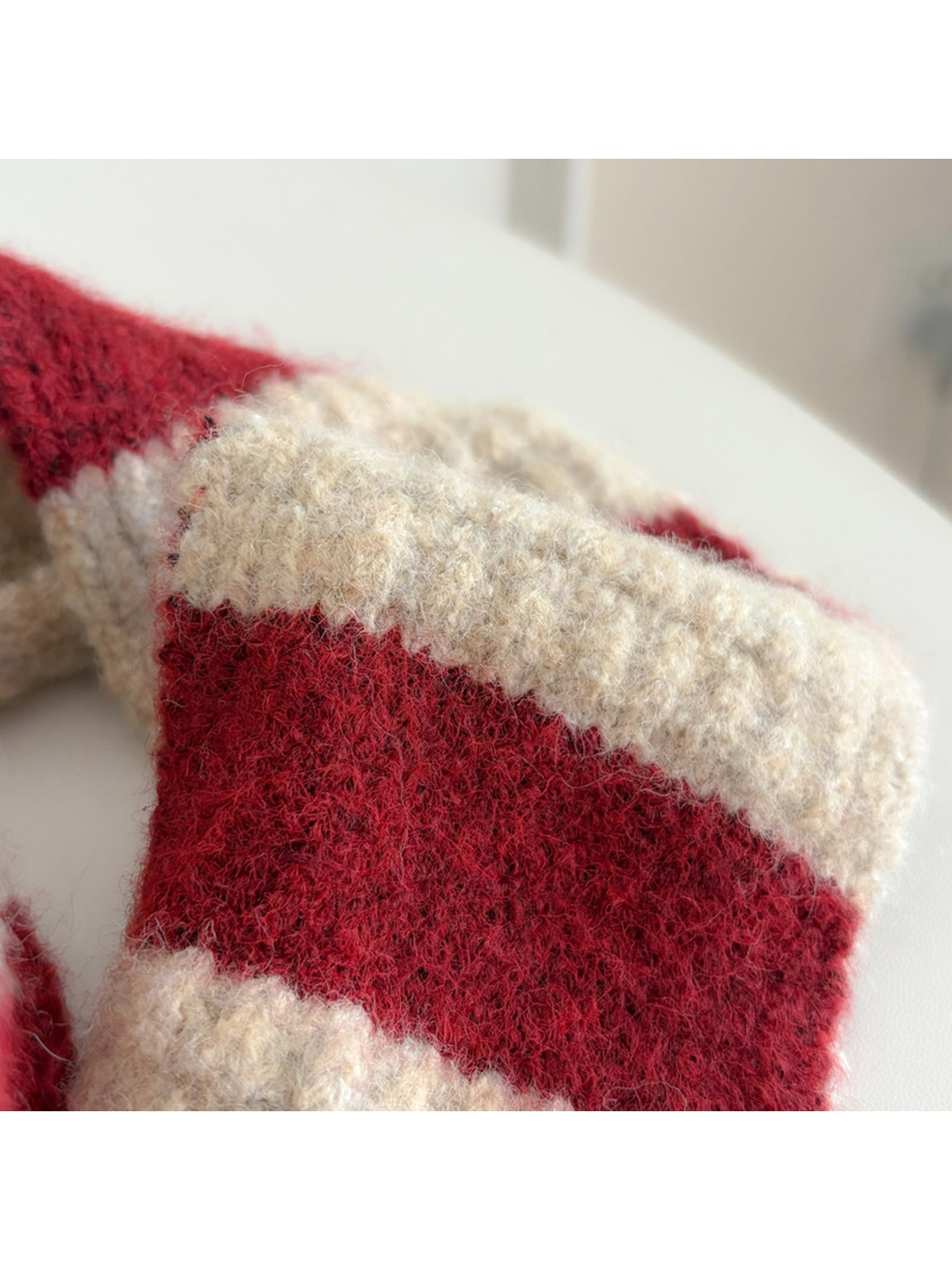 Close view of the fuzzy red-and-cream striped texture