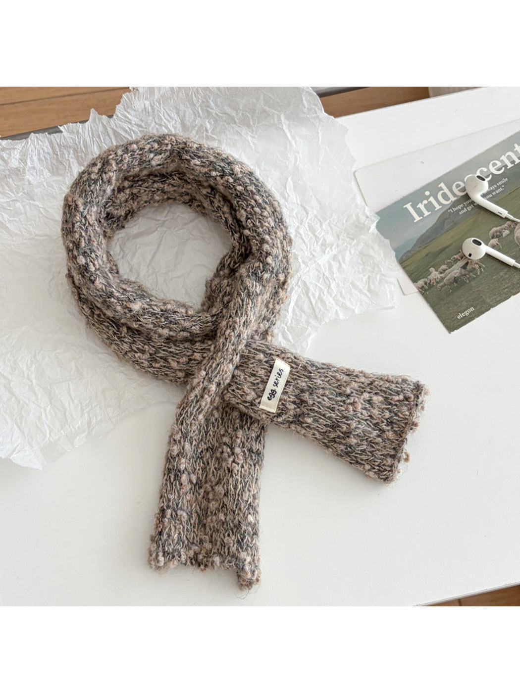 Greige narrow textured scarf arranged in a loop