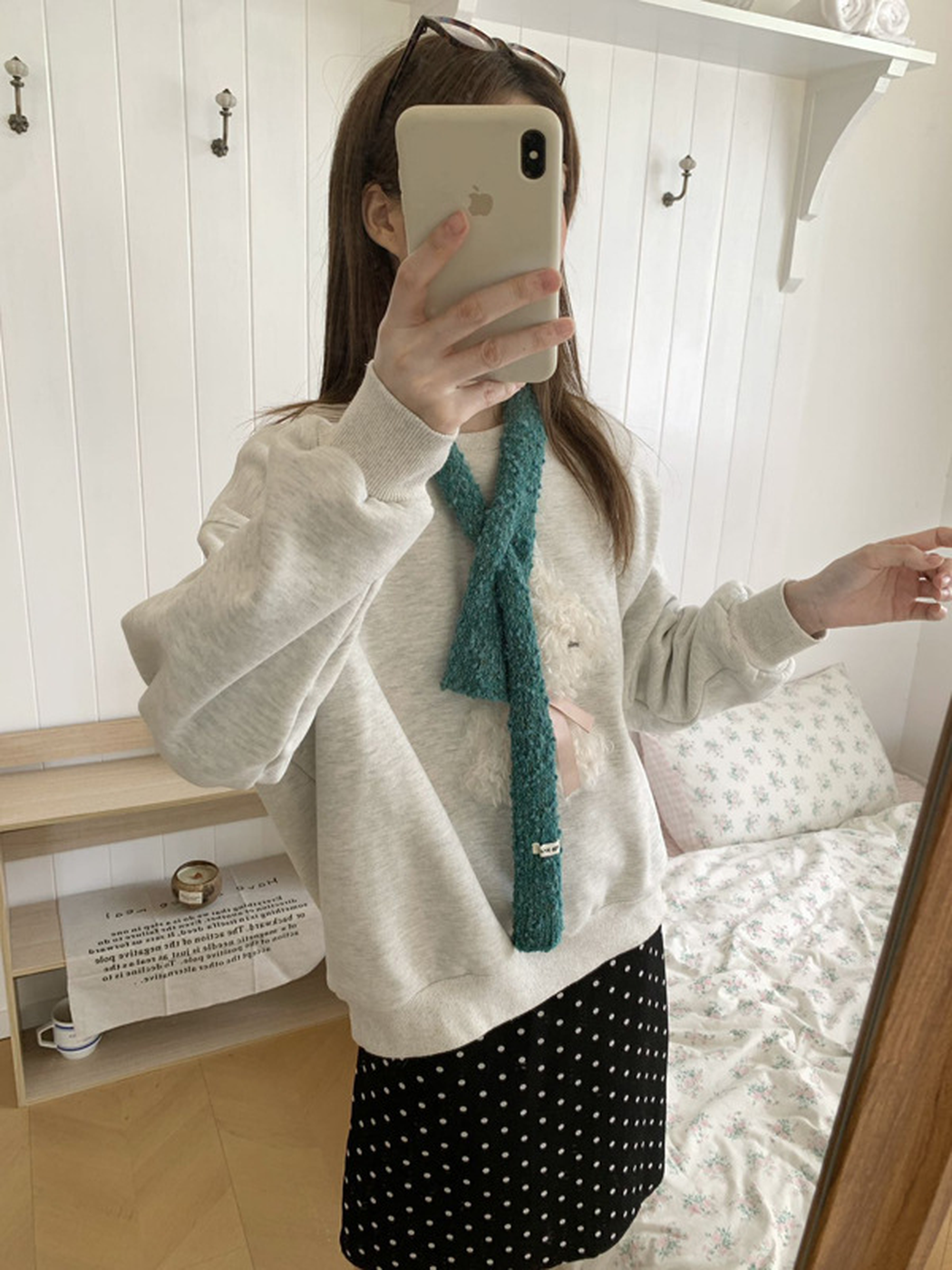 Teal Blue narrow scarf worn crossed over a gray sweatshirt