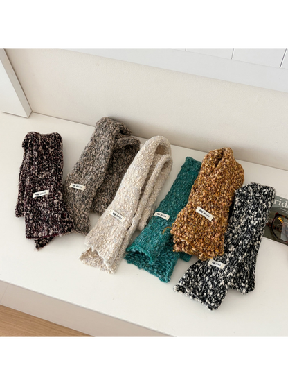 Six narrow textured scarf colors displayed in folded and open arrangements