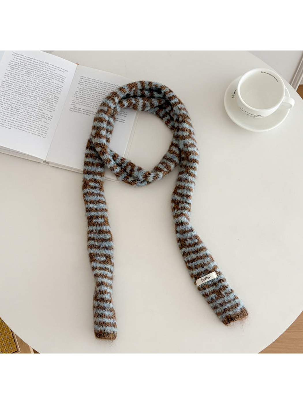 Light Blue fuzzy striped long narrow scarf laid flat