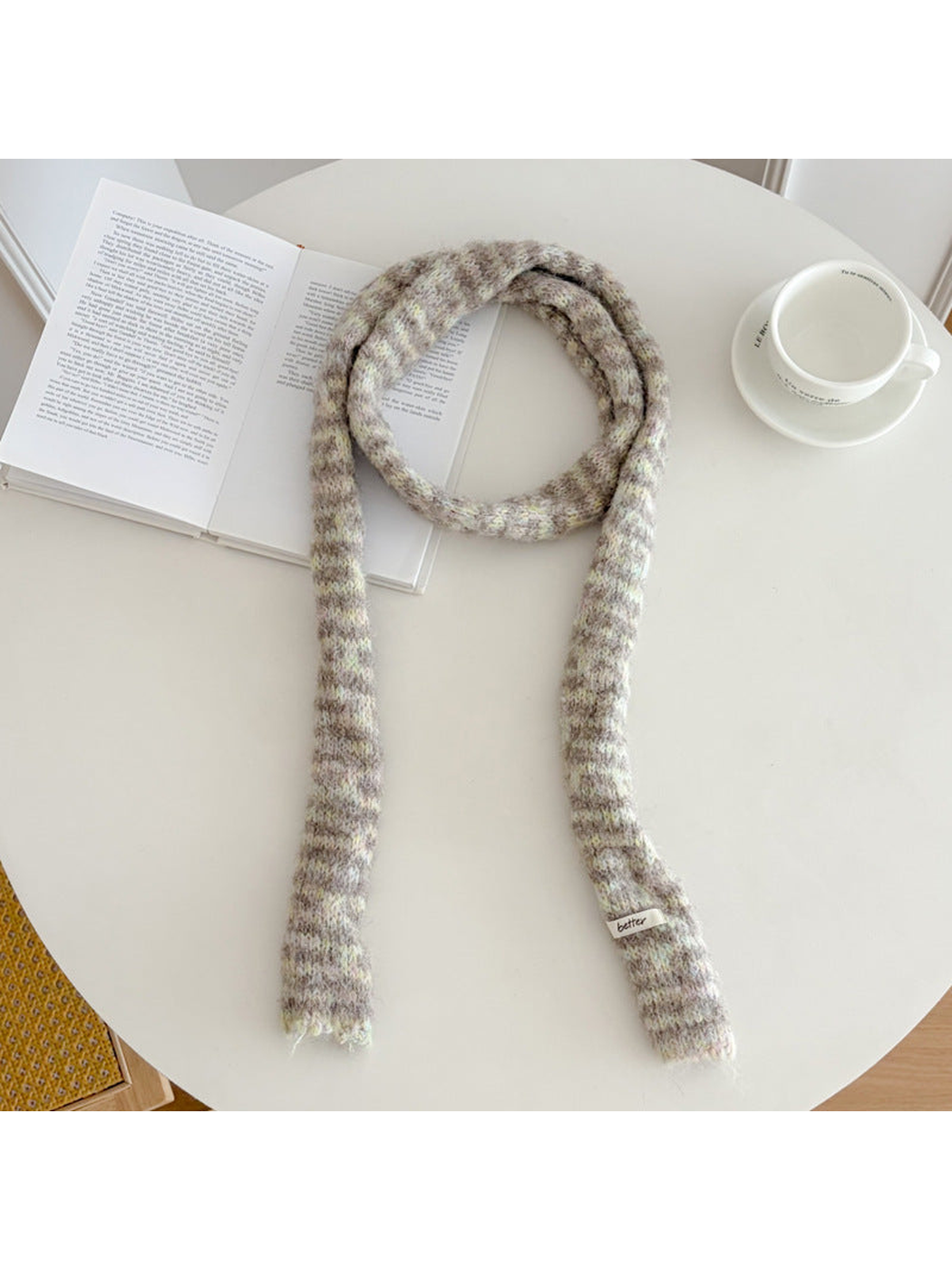 Beige fuzzy striped long narrow scarf laid flat