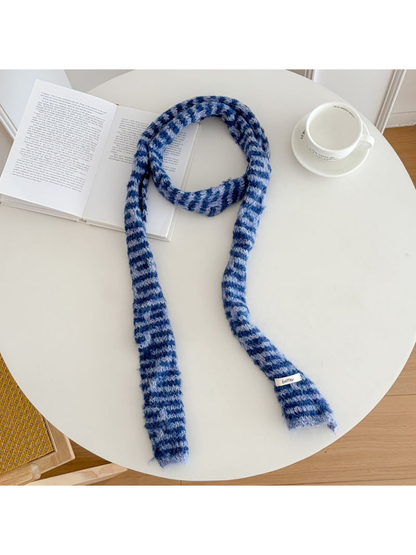 Blue fuzzy striped long narrow scarf laid flat