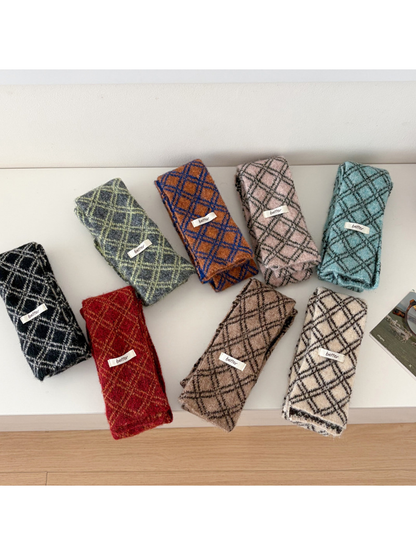 Eight diamond-check narrow scarf colors displayed folded together