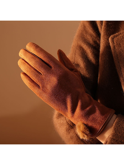 Caramel glove worn with a coordinating coat