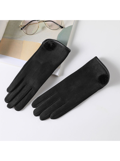 Black gloves with extended cuffs and fuzzy pom-pom accents