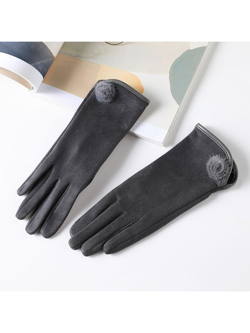 Gray gloves with extended cuffs and fuzzy pom-pom accents
