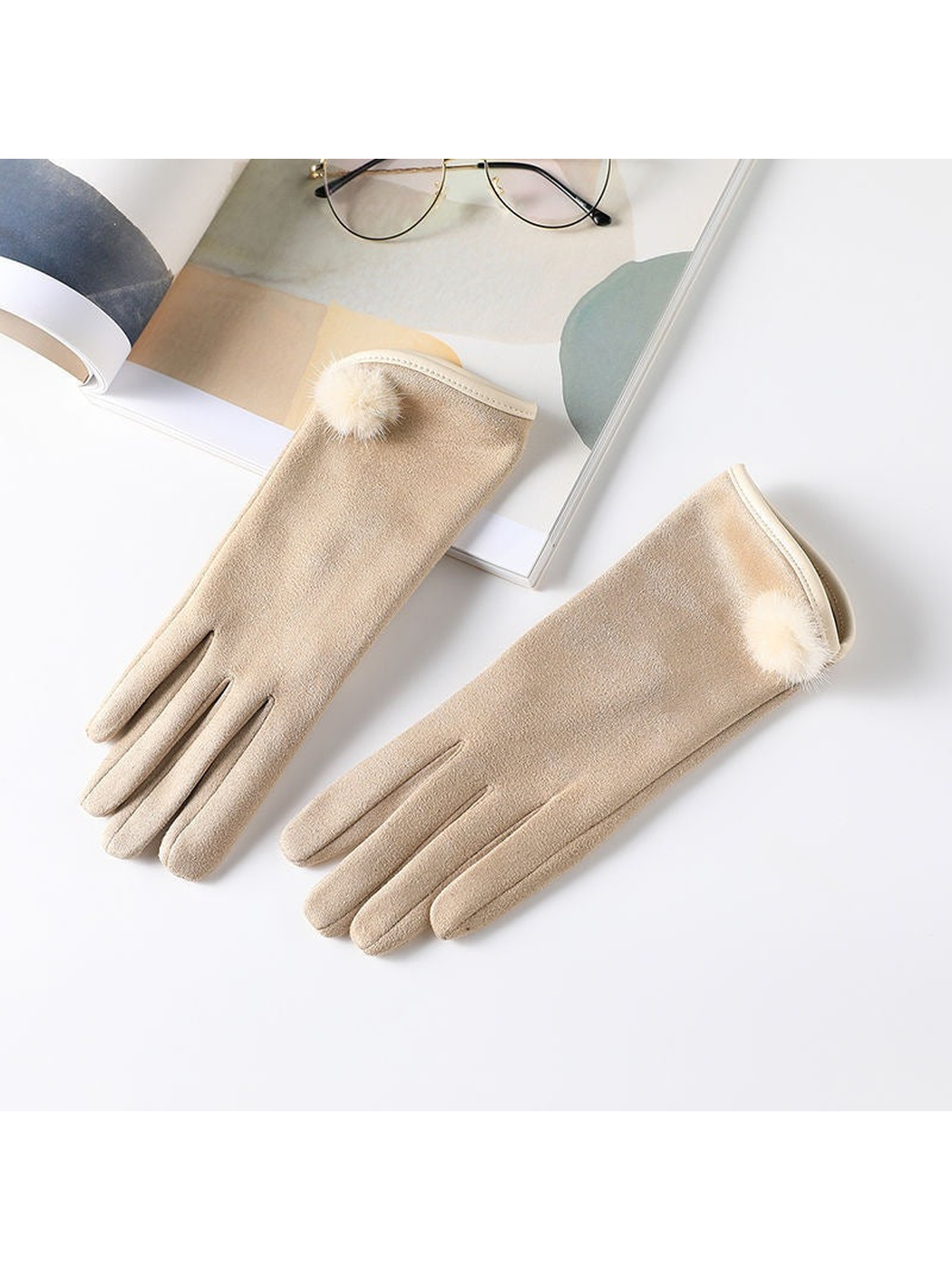 Beige gloves with extended cuffs and fuzzy pom-pom accents