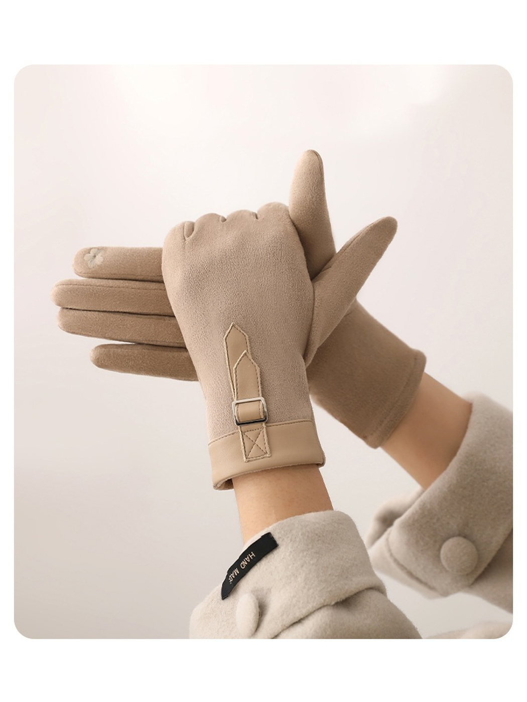 Beige gloves showing the buckle strap and palm construction