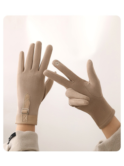 Beige gloves showing the palm seams and small fingertip motif