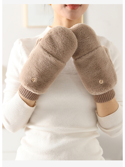 Beige fuzzy mittens worn with the fold-back covers closed