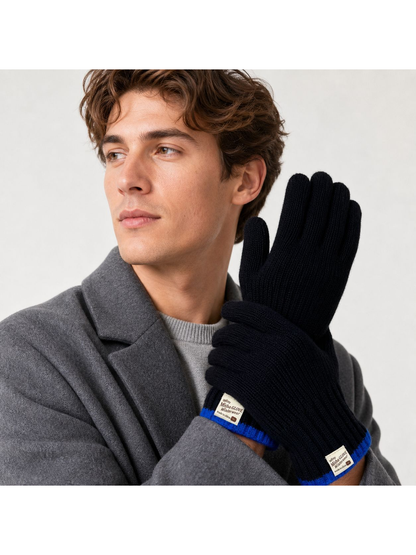 Black ribbed gloves with blue cuff trim styled with a gray coat