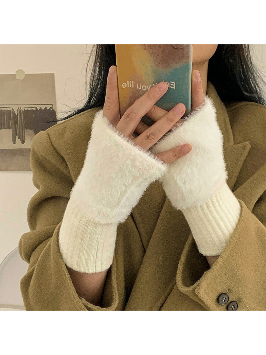 White fuzzy fingerless gloves worn with a camel coat