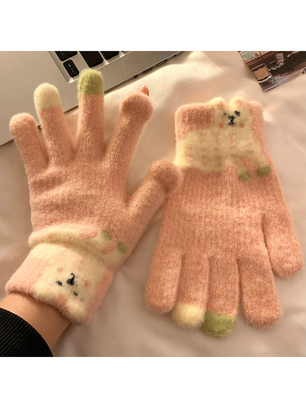 Pink fuzzy gloves with a cream long-eared character appliqué